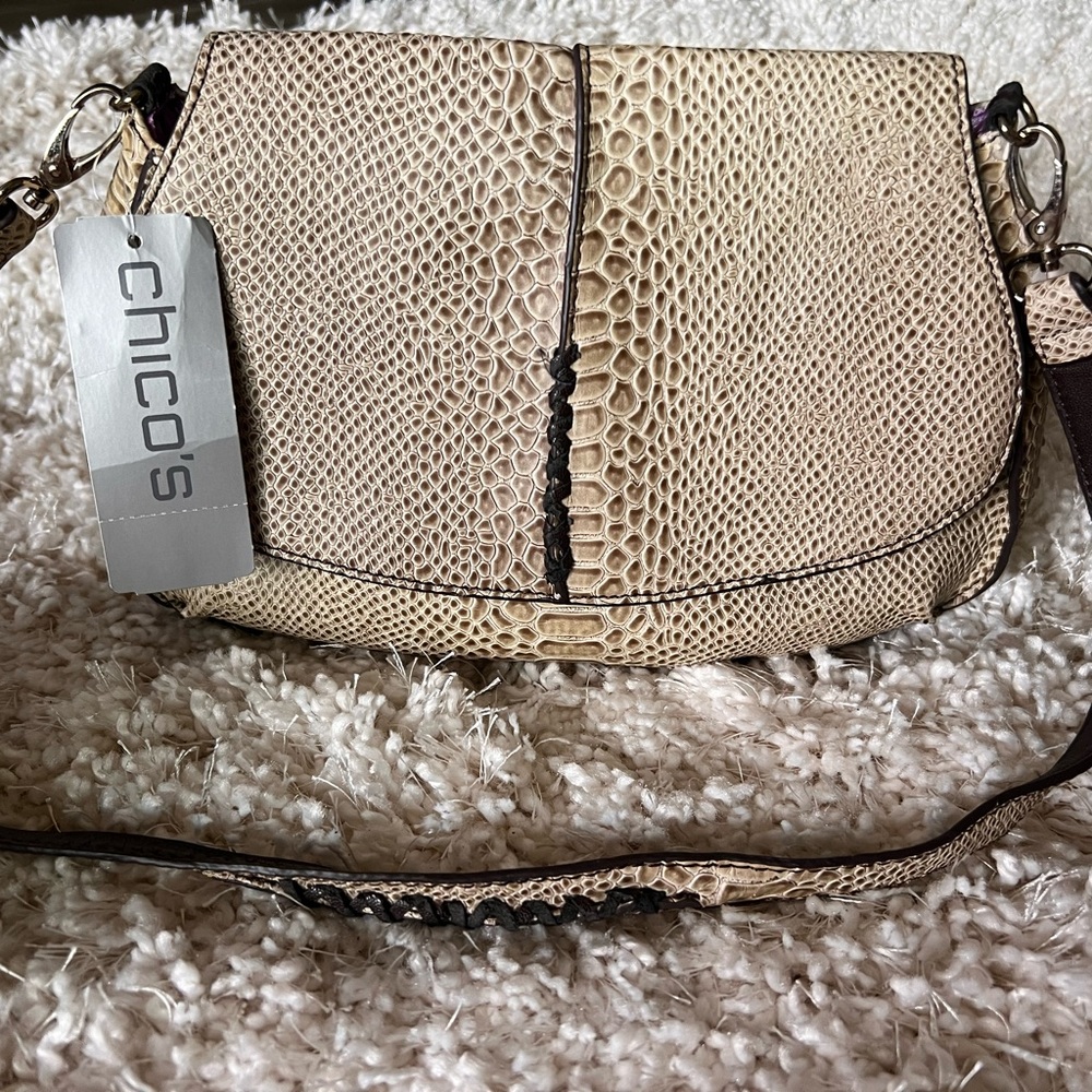 Chico’s snakeskin, embossed bag with purple satin interior